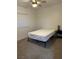 Bright bedroom with neutral carpet, minimalist decor, and a window providing natural light at 335 W Basic Rd, Henderson, NV 89015