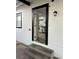 Welcoming home entrance, showcasing a glimpse of the updated kitchen with modern appliances at 335 W Basic Rd, Henderson, NV 89015