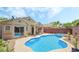 Sparkling backyard pool and patio featuring outdoor seating and mature landscaping at 3495 Eagle Bend St, Las Vegas, NV 89122