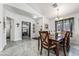 Bright dining area with tile floors, pendant lighting, and a view into the adjacent living spaces at 3495 Eagle Bend St, Las Vegas, NV 89122