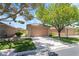 Charming single-story home with a well-manicured lawn, mature shade trees, and a two-car garage at 3495 Eagle Bend St, Las Vegas, NV 89122