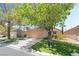 Charming single-story home with a well-maintained lawn and mature trees offering shade and curb appeal at 3495 Eagle Bend St, Las Vegas, NV 89122
