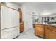 Efficient kitchen layout with a refrigerator and adjacent pantry, offering plenty of storage and functionality at 3495 Eagle Bend St, Las Vegas, NV 89122