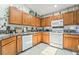 Functional kitchen featuring a gas range, microwave, and tile backsplash, perfect for home cooking at 3495 Eagle Bend St, Las Vegas, NV 89122
