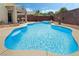 Gorgeous backyard pool with a blue tile edge and a sunny patio area with a rubber ducky at 3495 Eagle Bend St, Las Vegas, NV 89122