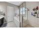 Bright bathroom with soaking tub, glass shower, and large vanity at 4523 Herbert River Ave, Las Vegas, NV 89141