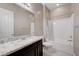Modern bathroom featuring a granite countertop, a soaking tub, and a shower at 4523 Herbert River Ave, Las Vegas, NV 89141