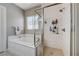 Bathroom boasting a soaking tub, walk-in shower, and stylish tile work at 4523 Herbert River Ave, Las Vegas, NV 89141