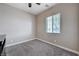 This is a simple carpeted bedroom with a window bringing natural light into the room at 4523 Herbert River Ave, Las Vegas, NV 89141
