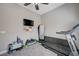 Carpeted exercise room with a treadmill, TV, and motivational decor at 4523 Herbert River Ave, Las Vegas, NV 89141