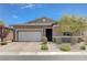 Charming single-story home featuring a two-car garage, desert landscaping, and a welcoming facade at 4523 Herbert River Ave, Las Vegas, NV 89141
