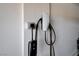 Electric vehicle chargers, both Tesla and VW, installed on the garage wall for convenient and modern charging solutions at 4523 Herbert River Ave, Las Vegas, NV 89141