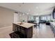 Open floor plan with kitchen, dining area, and living room, offering a great space for entertaining at 4523 Herbert River Ave, Las Vegas, NV 89141