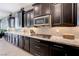 Modern kitchen features stainless steel appliances, granite countertops, and stylish backsplash at 4523 Herbert River Ave, Las Vegas, NV 89141