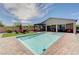 Stunning backyard pool and patio area with comfortable seating for outdoor relaxation and entertaining in the desert sun at 4523 Herbert River Ave, Las Vegas, NV 89141