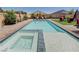 Backyard pool with attached hot tub, perfect for outdoor entertainment or relaxing under the sun at 4523 Herbert River Ave, Las Vegas, NV 89141