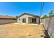 The backyard features block wall fencing, a covered patio, and endless possibilities at 5004 Celebrity Cir, Las Vegas, NV 89119