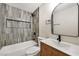 Modern bathroom featuring a tiled shower with a built-in niche, a new vanity, and a new toilet at 5004 Celebrity Cir, Las Vegas, NV 89119