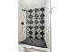 Contemporary walk-in shower featuring bold tile design and matte black fixtures at 5004 Celebrity Cir, Las Vegas, NV 89119