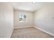 Bedroom with carpeted floors and a window providing natural light at 5004 Celebrity Cir, Las Vegas, NV 89119