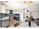 Well-lit kitchen boasts two-tone cabinets, stainless steel appliances, and an eat-in area at 5004 Celebrity Cir, Las Vegas, NV 89119