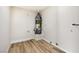 A hot water heater is installed in a closet with tile-look wood flooring and a small window at 5004 Celebrity Cir, Las Vegas, NV 89119