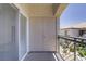 Balcony featuring a gated door, and railing overlooking the neighborhood at 5112 Harvest Time St # 201, Las Vegas, NV 89130