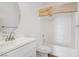 Bathroom featuring a combination tub and shower, modern vanity, faucet, and a decorative wood beam at 5112 Harvest Time St # 201, Las Vegas, NV 89130