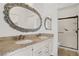 Bright bathroom with double sinks, granite countertops, and custom mirrors at 5112 Harvest Time St # 201, Las Vegas, NV 89130