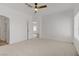 Spacious bedroom with a ceiling fan and an open doorway at 5112 Harvest Time St # 201, Las Vegas, NV 89130