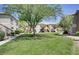Expansive grass lawn and mature trees featured on community grounds at 5112 Harvest Time St # 201, Las Vegas, NV 89130