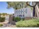 Attractive 'Pueblo at Santa Fe' community sign surrounded by lush landscaping at 5112 Harvest Time St # 201, Las Vegas, NV 89130