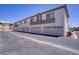Multi-unit residential building showcasing attached garages for convenient parking at 5112 Harvest Time St # 201, Las Vegas, NV 89130