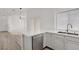 Open floor plan with view of the kitchen with stainless steel appliances and lots of natural light at 5112 Harvest Time St # 201, Las Vegas, NV 89130