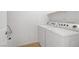 Bright laundry room with a modern side-by-side washer and dryer, plus utility connections at 5112 Harvest Time St # 201, Las Vegas, NV 89130
