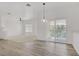 Living room with neutral tones, ceiling fan, and sliding door to the outside at 5112 Harvest Time St # 201, Las Vegas, NV 89130