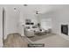 Bright living room with a ceiling fan, modern furniture, and a decorative fireplace at 5112 Harvest Time St # 201, Las Vegas, NV 89130