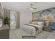 Serene main bedroom with a floral wall, large window, and neutral tones at 5112 Harvest Time St # 201, Las Vegas, NV 89130