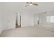 Large main bedroom with mirrored closet doors, ceiling fan, and access to the main bath at 5112 Harvest Time St # 201, Las Vegas, NV 89130