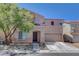 Charming two-story home featuring a two-car garage and well-maintained landscaping at 554 Haunts Walk Ave, Las Vegas, NV 89178