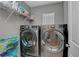 Convenient laundry room featuring newer front load washer and dryer at 554 Haunts Walk Ave, Las Vegas, NV 89178