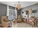Stylish living room with accent chairs, modern lighting, and decorative accessories at 554 Haunts Walk Ave, Las Vegas, NV 89178