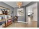 Open-concept living area showcasing modern décor and wood-look tile flooring at 554 Haunts Walk Ave, Las Vegas, NV 89178