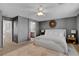 Comfortable main bedroom with neutral decor, ceiling fan, and adjoining bathroom at 554 Haunts Walk Ave, Las Vegas, NV 89178