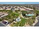 Aerial view of the community park with a pool, splash pad, grass area and mature trees at 5656 Fast Payout Ct, Las Vegas, NV 89122