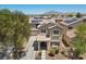 Charming home with solar panels, landscaped yard, and inviting front porch, showcasing suburban appeal at 5656 Fast Payout Ct, Las Vegas, NV 89122
