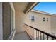 An open balcony featuring an iron railing and a view of the adjacent building at 5656 Fast Payout Ct, Las Vegas, NV 89122