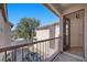 An open balcony featuring an iron railing and a view of the neighborhood at 5656 Fast Payout Ct, Las Vegas, NV 89122