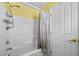 Bright bathroom featuring a shower and bathtub combination with white tile surround at 5656 Fast Payout Ct, Las Vegas, NV 89122