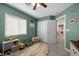 bedroom boasts natural light from the window and creative decor at 5656 Fast Payout Ct, Las Vegas, NV 89122